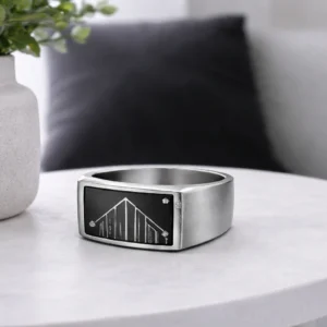 architectural ring with grey background and clean lines.