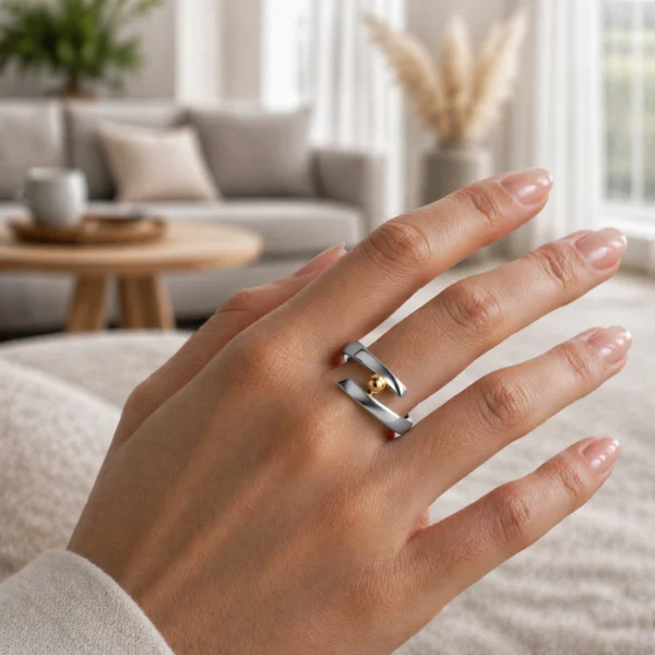 minimalism ring with a gold detail worn on hand in minimalist scandinavian interior